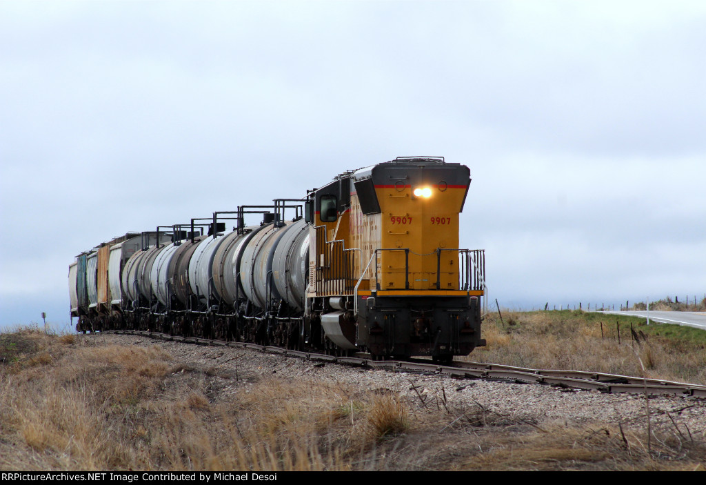 UP SD59MX #9907, running LHF, leads the southbound Cache Valley Local (LCG-41E) approaching the W. 4600 N. at Cache Junction, Utah. April 15, 2022